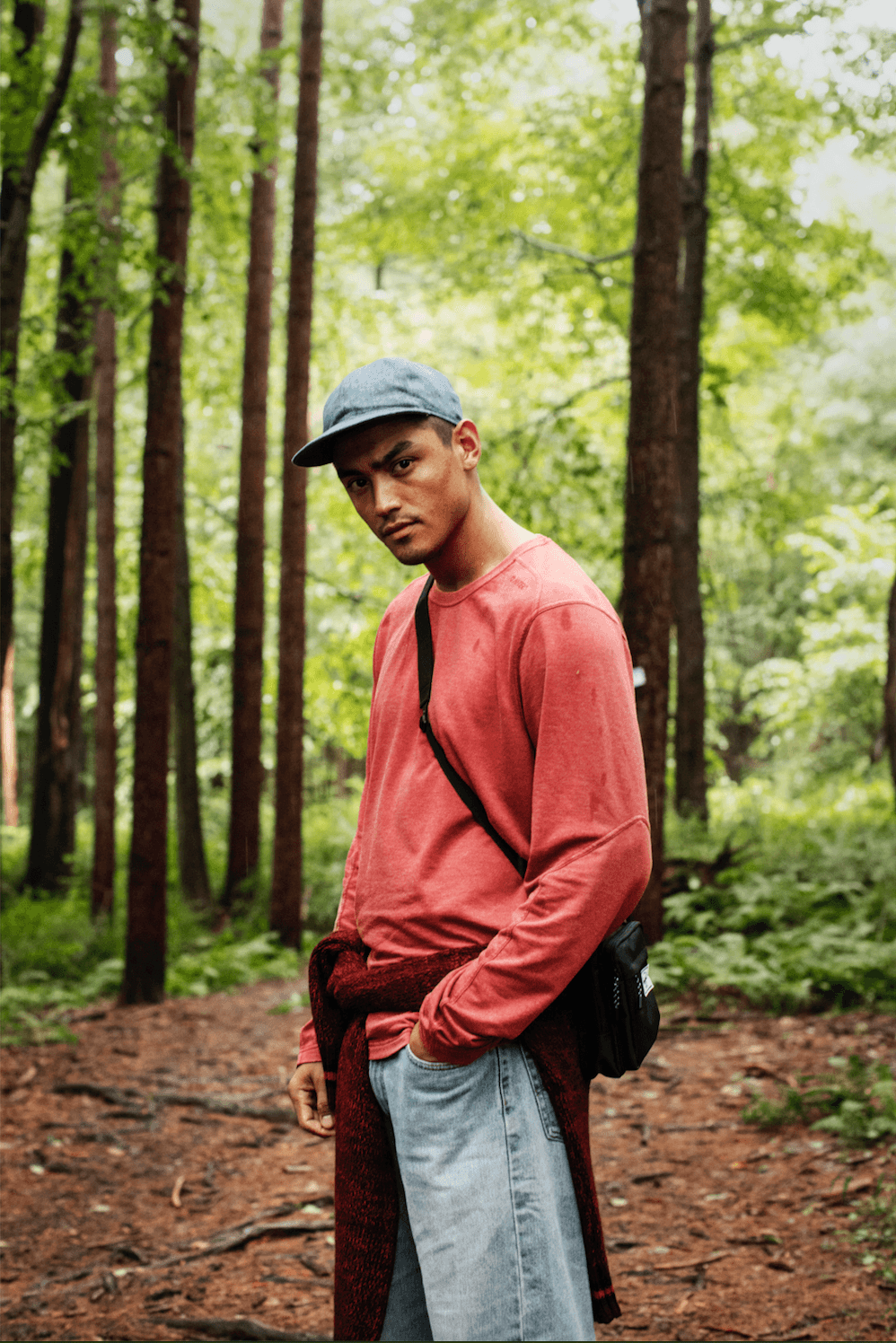 Image may contain Vegetation Plant Clothing Apparel Human Person Woodland Tree Outdoors Nature Land and Forest